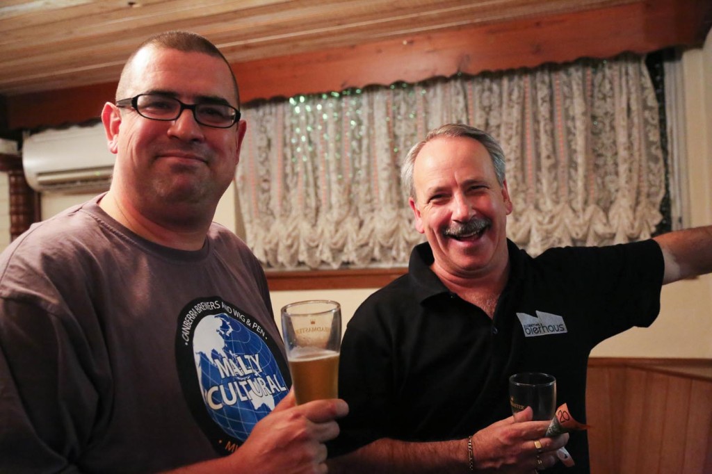Charles ‘Chuck’ Newton and Chris "Growler" De La Rue enjoying a beer